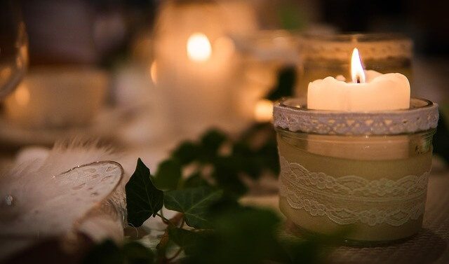 A lit candle at church.